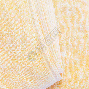干净的黄色毛巾质地和无缝背景特写图片