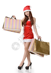 亚洲圣诞女孩购物和拿着袋子白色背景的图片