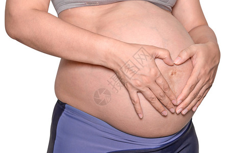 孕妇用手隔离在白色背景上图片