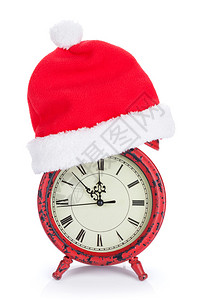 带圣诞老人帽子的圣诞钟在白色背景下被隔离图片