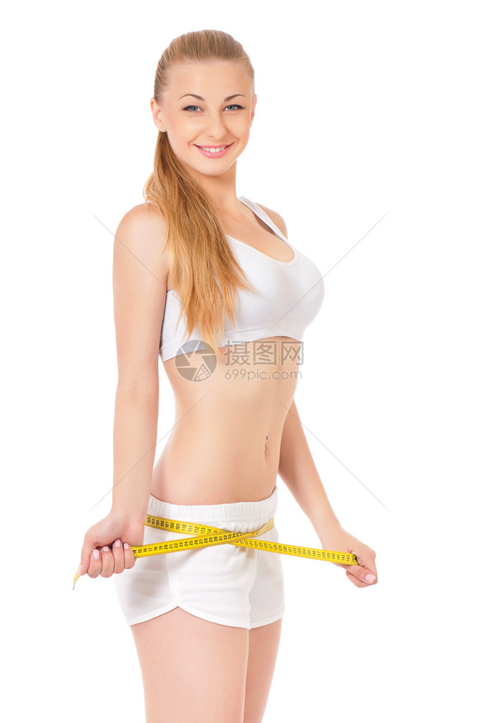 微笑快乐的女健身模式用测量胶带看相图片