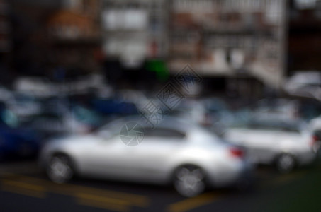 汽车在停车场的Bokeh背景图片