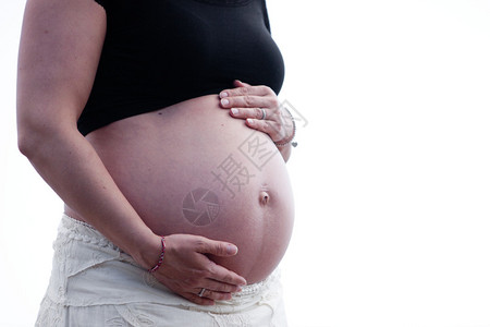 孕妇手捂着肚子图片