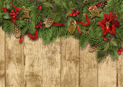 木制背景上的圣诞边框设计图片