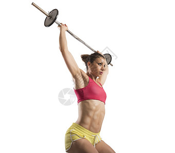 用杠铃做高强度锻炼的肌肉女背景图片