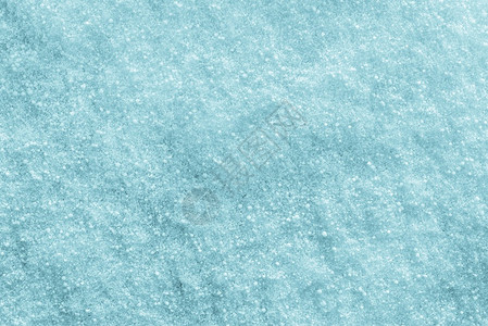 冬雪的水晶质感覆盖了绿松石色冬雪的闪亮和闪发光的抽象质感背景图片