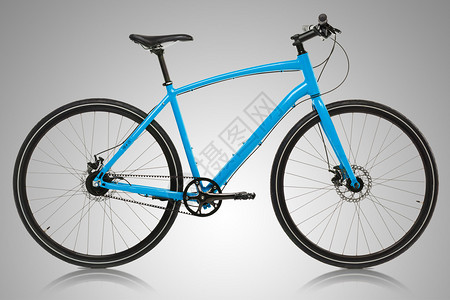 灰色背景上的新蓝色自行车图片