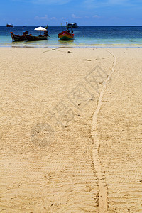 白沙滩海滨石礁船和南中华海锚的河背景图片