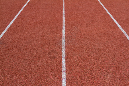 在体育场的红色跑道背景图片