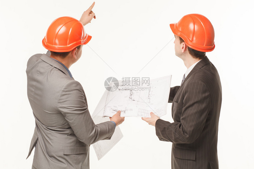 建筑商讨论绘制图纸构图片