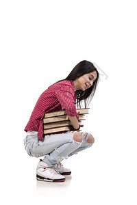 女青年学生书籍被白色隔离图片