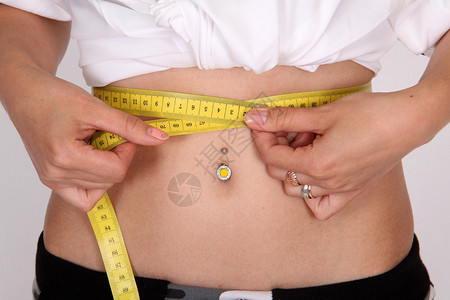 饮食测量腰围的女孩背景图片