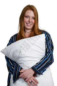 美丽的年轻女子穿着睡衣她的枕头图片