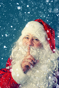 真正的圣诞老人圣诞老人用手指对着他的嘴图片