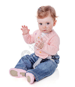 一年岁的女婴坐在拍掌的手掌图片