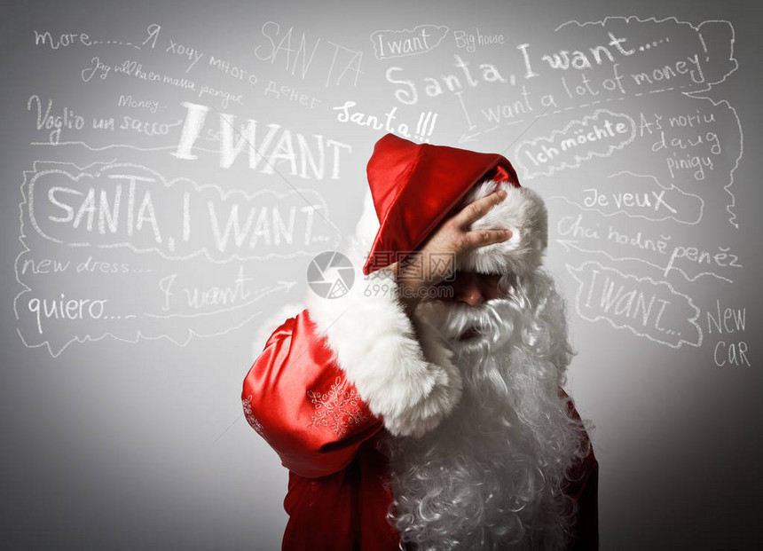沮丧的圣诞老人患有头痛和许多愿图片
