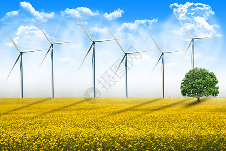 夏日在农田上旋转的风能涡轮机图片