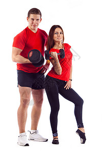 与女一起做运动的肌肉健体建筑男用哑铃在白色背图片
