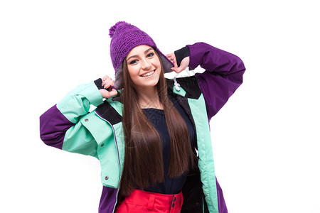 穿紫色滑雪大衣的年轻美女在白色上被孤立图片