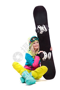 白色迷人的年轻白人女孩身着五颜六色的滑雪服蓝色雪地靴和黄色长裤图片