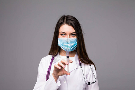 医生或护士面罩和实验室大衣图片