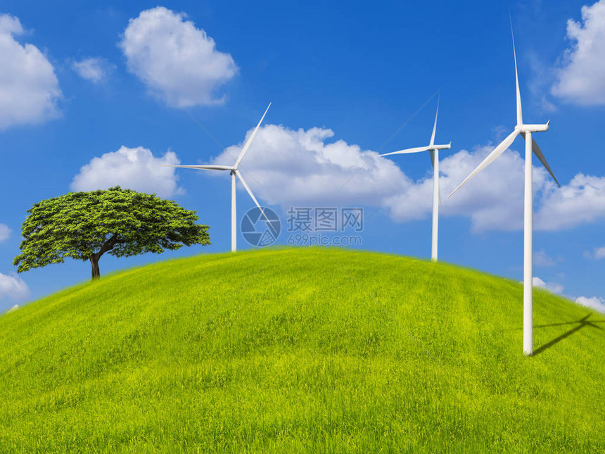 风力涡轮机在草山和蓝天上用云发图片
