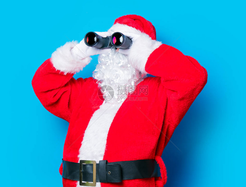 有趣的圣诞老人玩得开心蓝色背景图片