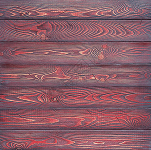 背景由用红色黑漆染色的木制水平图片