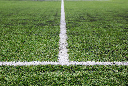 绿色人造草足球场纹理和背景背景图片