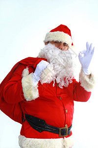 圣诞老人带着礼物袋奔跑图片