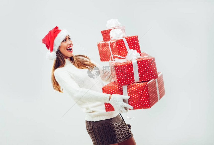 满头戴圣诞帽子的欢笑微的女人图片