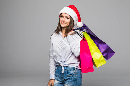 有购物袋的幸福女人圣诞礼物圣诞购物女孩ghite上孤图片