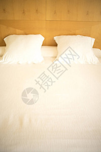 豪华现代酒店式套房卧室床单枕头干净背景图片