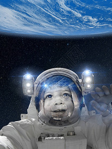 航天服中的宇航员儿童从轨道指向地球图片