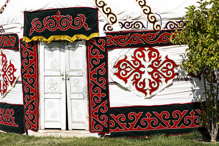 秀水乌兹别克斯坦的蒙古包传统工艺品和图案背景