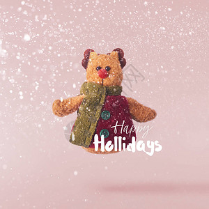 圣诞节的概念创意圣诞概念是在粉红色背景下坠入空中圣诞可爱的鹿玩具图片