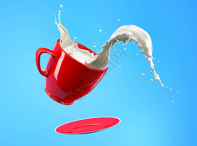 奶水在红杯和碟子中喷洒在蓝图片