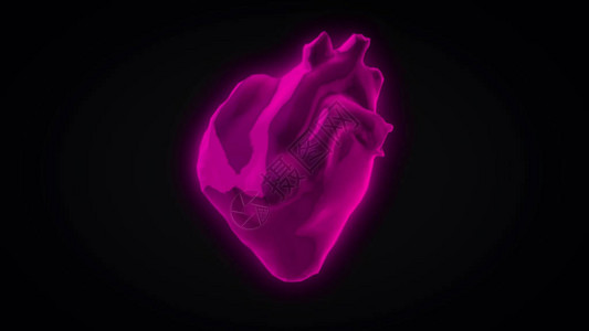 色彩多的3D心脏跳动模型在黑暗背景上旋转的高清图片