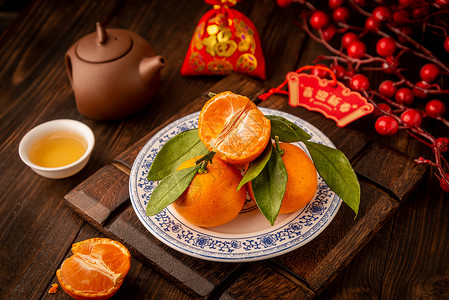 木桌上的水果橘子节日背景背景图片