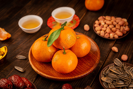 木桌上的水果橘子背景图片
