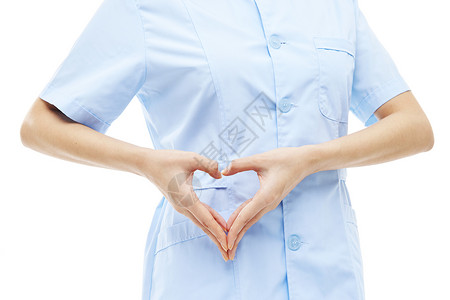 爱心护理素材年轻女护士爱心手势特写背景