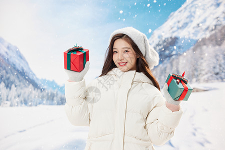 可爱冬季女孩手拿圣诞礼盒形象图片