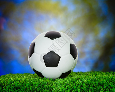 以绿草田足球为体育比赛背景使用足球背景图片