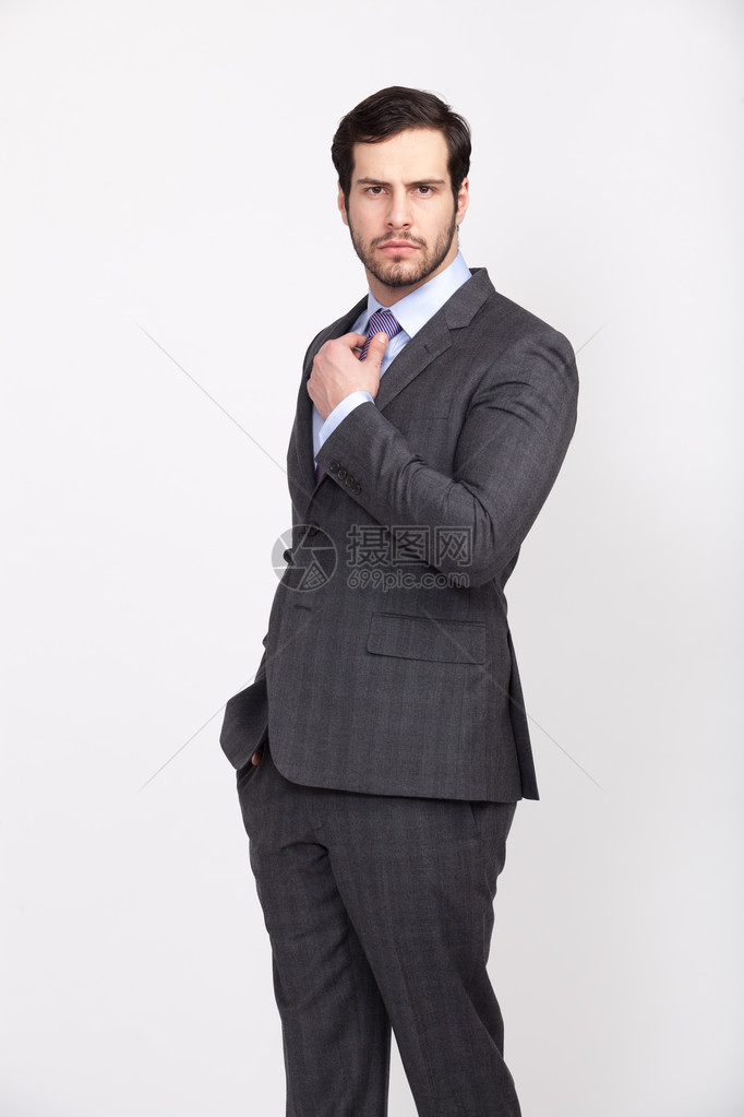 穿着灰色西装和胡子领带的优雅商图片