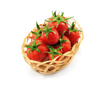 小木制柳条篮上面有白色的红番茄图片