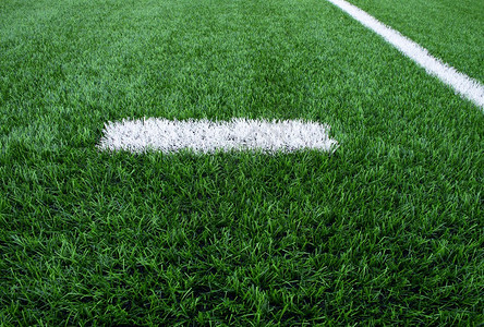 画在人工绿色地盘背景上的白线标记冬季足球操图片