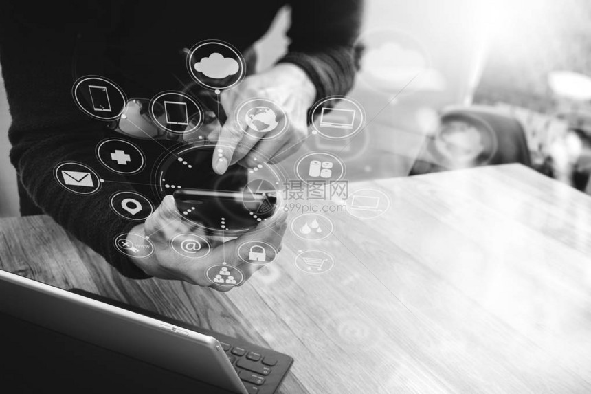 在现代办公室木制办公桌icons图形界面屏幕眼镜黑白的网上购物全线频道使用移动图片