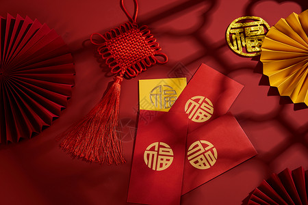 中国风扇子装饰春节新年中国结与烫金红包背景