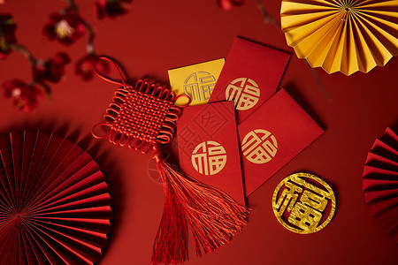 中国风扇子装饰新年中国结与烫金红包背景