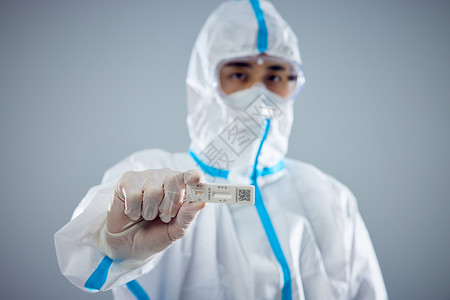 防控新型冠状病毒感染防疫医护人员手拿抗原特写背景